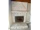 Stone fireplace with wood mantel and hearth at 368 Fairgreen Pl, Casselberry, FL 32707