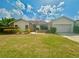 Single-story home with attached garage and landscaped yard at 368 Fairgreen Pl, Casselberry, FL 32707
