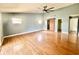 Spacious living area with hardwood floors and sliding doors at 368 Fairgreen Pl, Casselberry, FL 32707
