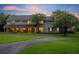 Lovely two story home with a long driveway and manicured lawn at 1709 Onondaga Dr, Geneva, FL 32732