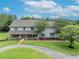 Two-story home with landscaping and driveway at 1709 Onondaga Dr, Geneva, FL 32732