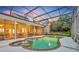 Stunning pool and spa with screened enclosure at dusk at 1709 Onondaga Dr, Geneva, FL 32732