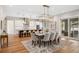 Open concept dining area adjacent to the kitchen, with a large table and chandelier at 2041 Companero Ave, Orlando, FL 32804