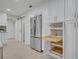 Bright kitchen with stainless steel refrigerator and ample storage at 1709 Onondaga Dr, Geneva, FL 32732
