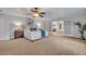 Large main bedroom with plush carpet and en-suite bathroom access at 1709 Onondaga Dr, Geneva, FL 32732