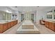Luxurious bathroom featuring a large soaking tub and double vanities at 1709 Onondaga Dr, Geneva, FL 32732