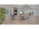 Open living room with brick fireplace and kitchen view at 1709 Onondaga Dr, Geneva, FL 32732