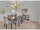 Formal dining room with chandelier and large artwork at 1709 Onondaga Dr, Geneva, FL 32732