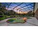 Relaxing screened pool and spa with sunset view at 1709 Onondaga Dr, Geneva, FL 32732