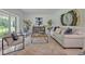 Cozy living room with large windows and seating at 1709 Onondaga Dr, Geneva, FL 32732