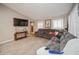 Spacious living room with sectional sofa and large TV at 218 Hillcrest Dr, Davenport, FL 33897
