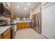 Kitchen features stainless steel appliances and wood cabinets at 218 Hillcrest Dr, Davenport, FL 33897
