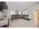 Living room features sectional sofa and hardwood floors at 218 Hillcrest Dr, Davenport, FL 33897