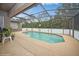 Inviting screened pool area, perfect for relaxation at 218 Hillcrest Dr, Davenport, FL 33897