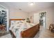 Large main bedroom with wood bed frame and walk-in closet at 218 Hillcrest Dr, Davenport, FL 33897