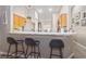 Kitchen features a breakfast bar with three stools and wood cabinets at 218 Hillcrest Dr, Davenport, FL 33897