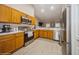 Modern kitchen with stainless steel appliances and wood cabinets at 218 Hillcrest Dr, Davenport, FL 33897