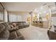 Open living room with a comfortable sectional sofa and a breakfast bar at 218 Hillcrest Dr, Davenport, FL 33897