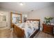 Main bedroom with wood bed frame and large mirror at 218 Hillcrest Dr, Davenport, FL 33897