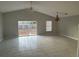 Spacious living room with tile floors and sliding glass doors at 7826 Camlyn Ct, Orlando, FL 32818