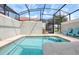 Private screened-in pool with patio furniture at 8951 Bismarck Palm Rd, Kissimmee, FL 34747