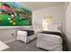 bedroom with two twin beds and Mickey Mouse wall at 8951 Bismarck Palm Rd, Kissimmee, FL 34747