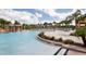 Resort-style pool with waterfall feature and lounge area at 8951 Bismarck Palm Rd, Kissimmee, FL 34747