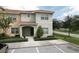 Two-story townhome with front yard and parking at 8951 Bismarck Palm Rd, Kissimmee, FL 34747