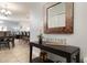 Bright entryway with console table and view to dining area at 8951 Bismarck Palm Rd, Kissimmee, FL 34747