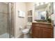 Bathroom with shower, toilet, and granite vanity at 8951 Bismarck Palm Rd, Kissimmee, FL 34747