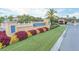 Paradise Palms community entrance with lush landscaping at 8951 Bismarck Palm Rd, Kissimmee, FL 34747