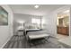 Comfortable bedroom with a queen-size bed and en-suite bathroom at 8951 Bismarck Palm Rd, Kissimmee, FL 34747
