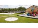 playground with a sandbox and play equipment at 8951 Bismarck Palm Rd, Kissimmee, FL 34747
