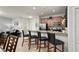Modern kitchen with stainless steel appliances and breakfast bar at 8951 Bismarck Palm Rd, Kissimmee, FL 34747