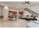 Open living space with kitchen island, seating area, and staircase at 20606 Quinn St, Orlando, FL 32833