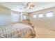 Spacious bedroom with carpet, ceiling fan, and large windows at 20606 Quinn St, Orlando, FL 32833