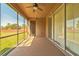 Relaxing screened porch with sliding glass doors and backyard access at 20606 Quinn St, Orlando, FL 32833
