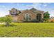 Two-story house with a large front yard, two-car garage, and landscaping at 20606 Quinn St, Orlando, FL 32833