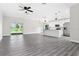 Open concept kitchen with island and stainless steel appliances at 43 S Kentucky Ave, Umatilla, FL 32784