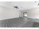 Open living space featuring wood-look floors and access to backyard at 43 S Kentucky Ave, Umatilla, FL 32784