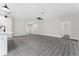 Bright and spacious living room with wood-look flooring and neutral walls at 43 S Kentucky Ave, Umatilla, FL 32784