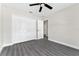 Bedroom with double door closet and wood-look floors at 43 S Kentucky Ave, Umatilla, FL 32784