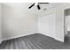 Bedroom with double door closet and wood-look floors at 43 S Kentucky Ave, Umatilla, FL 32784