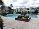 Community pool with lounge chairs and gazebo at 3480 Soho St # 101, Orlando, FL 32835