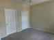 Bright bedroom with two closets and carpet flooring at 3480 Soho St # 101, Orlando, FL 32835