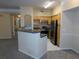 Modern kitchen with stainless steel appliances and a breakfast bar at 3480 Soho St # 101, Orlando, FL 32835