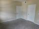 Bedroom with two closets and neutral walls at 3480 Soho St # 101, Orlando, FL 32835