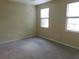 Spacious bedroom with neutral walls and carpet at 3480 Soho St # 101, Orlando, FL 32835