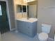 Bathroom with vanity, toilet and tiled floor at 3480 Soho St # 101, Orlando, FL 32835