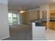 Spacious living room with sliding glass doors leading to a balcony at 3480 Soho St # 101, Orlando, FL 32835